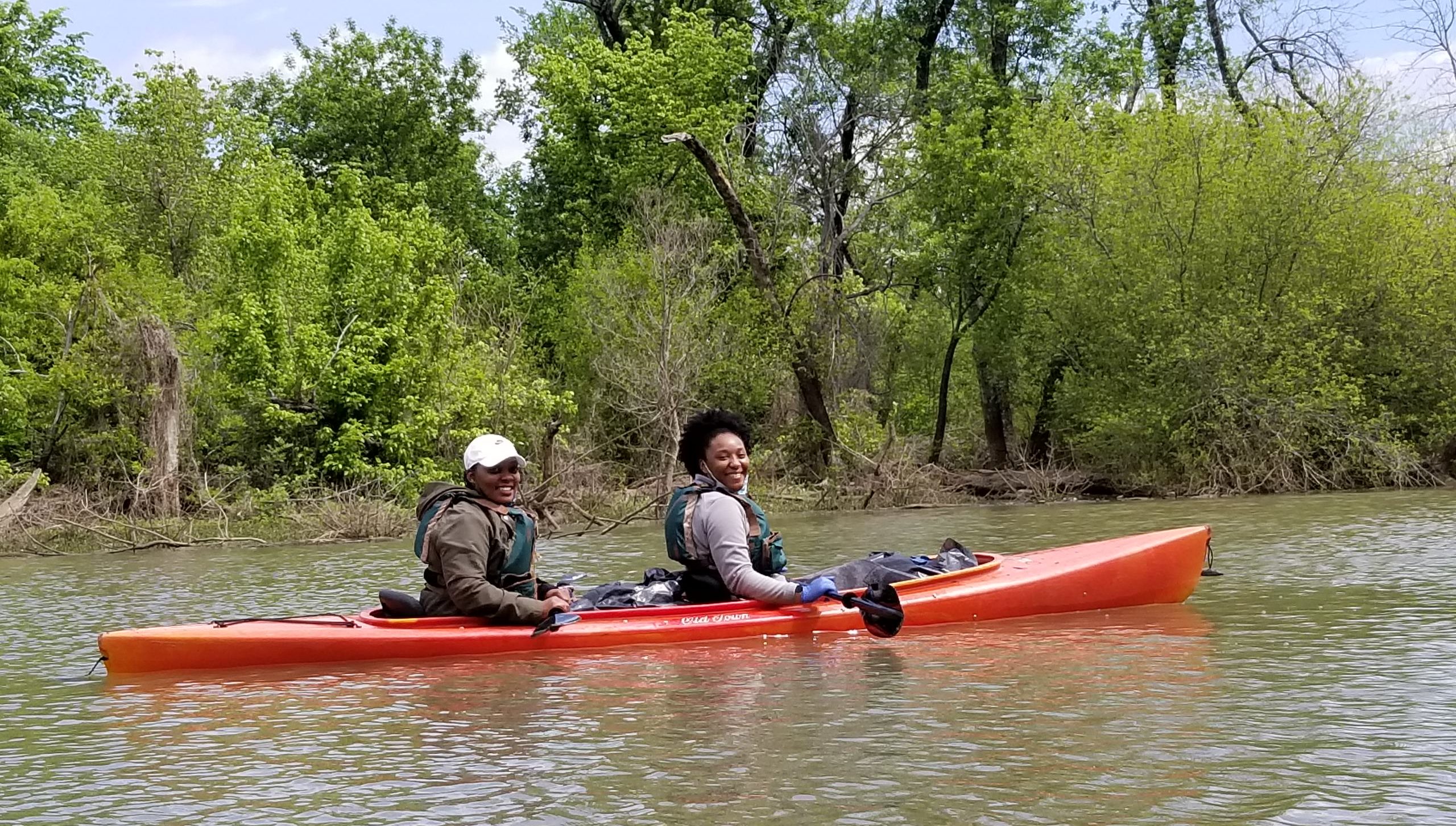 Two women kayaking in the Trinity River in Dallas