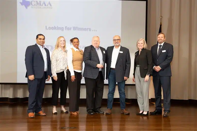 An image of the 2024 Construction Manager of the Year Michael Kennedy (center), with leadership members from the Construction Management Association of America (CMAA) Houston chapter.